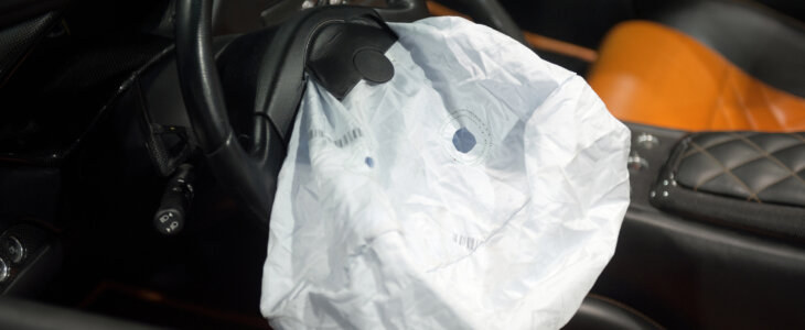 Deployed airbag in a luxury car