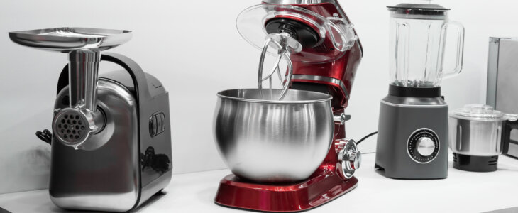 Small kitchen appliances lined up on a countertop