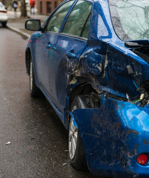 Hit and run involving a parked car on a city street.